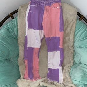 Empty soda pink white and purple jeans